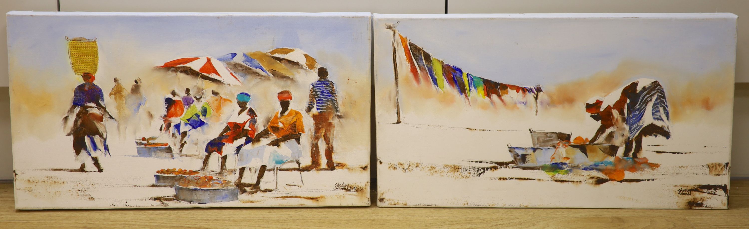 Stanley Sibanda (Zimbabwean), pair of oils on canvas, African market scenes, signed, 25 x 45cm, unframed